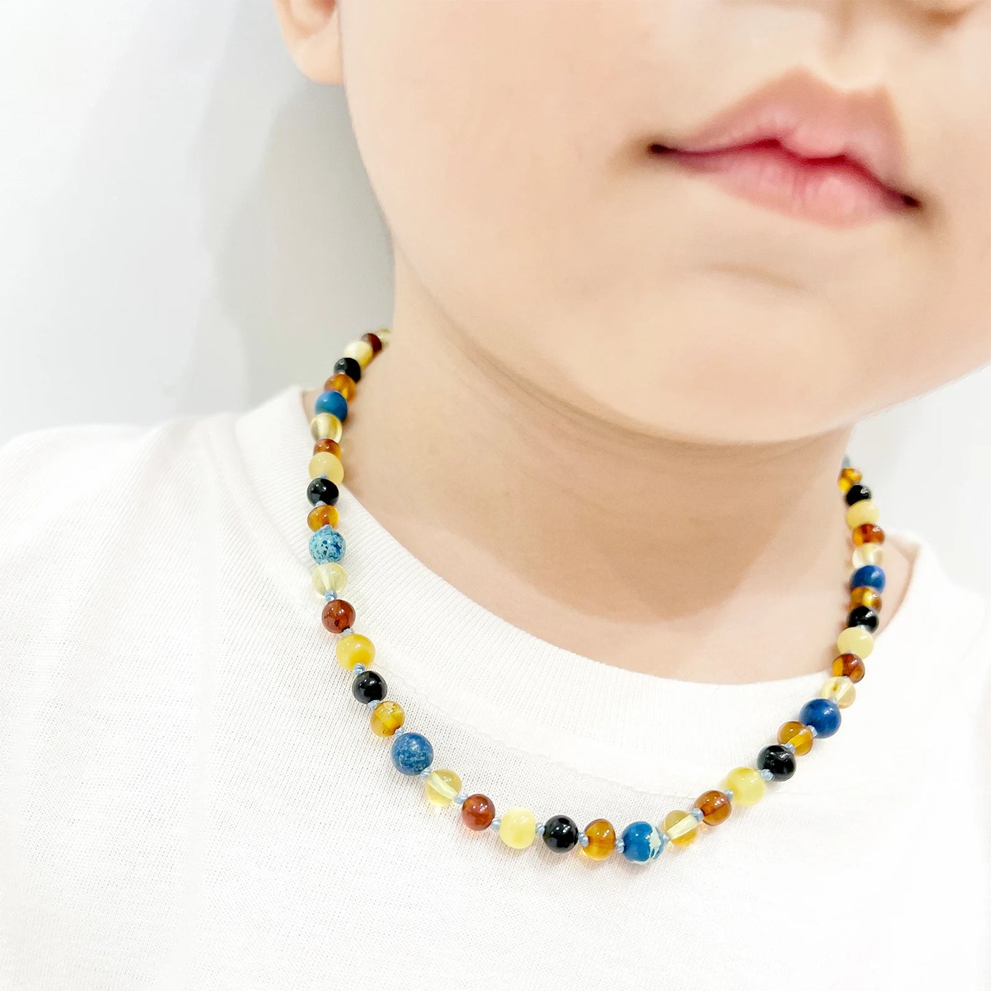 KALUNG AMBER DENGAN DEEP BLUE IMPERIAL JASPER UNTUK JUNIOR. JN101