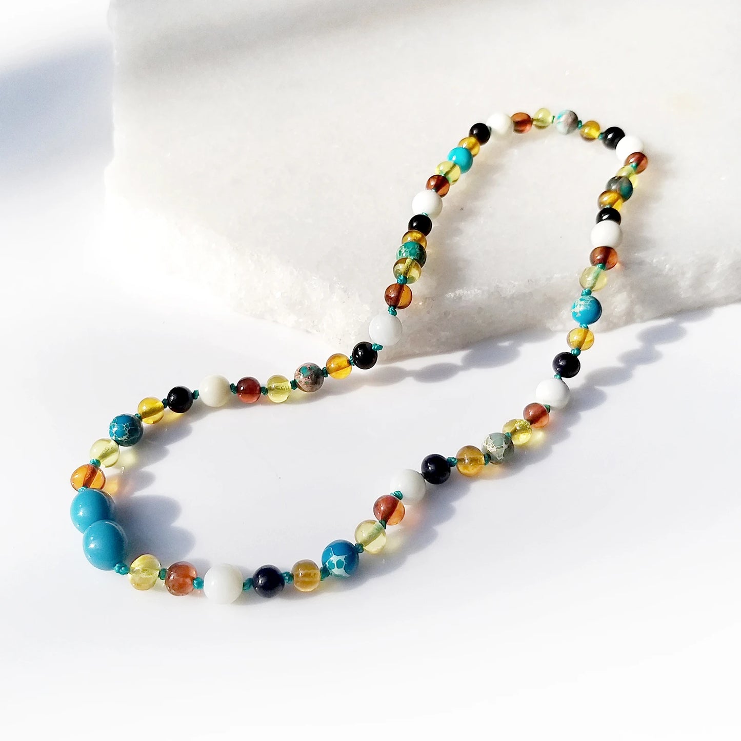 KALUNG AMBER DENGAN LAKE BLUE IMPERIAL JASPER UNTUK JUNIOR. JN96-T