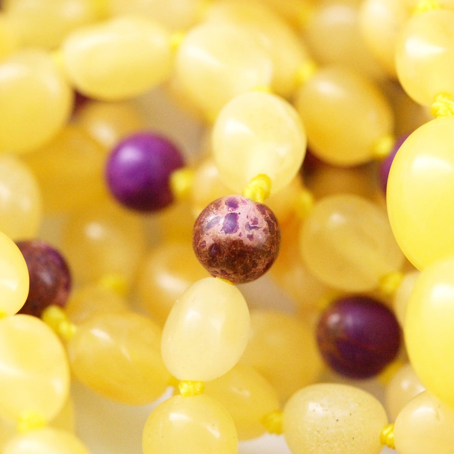 KALUNG BAYI AMBER DENGAN PURPLE IMPERIAL JASPER. LE479
