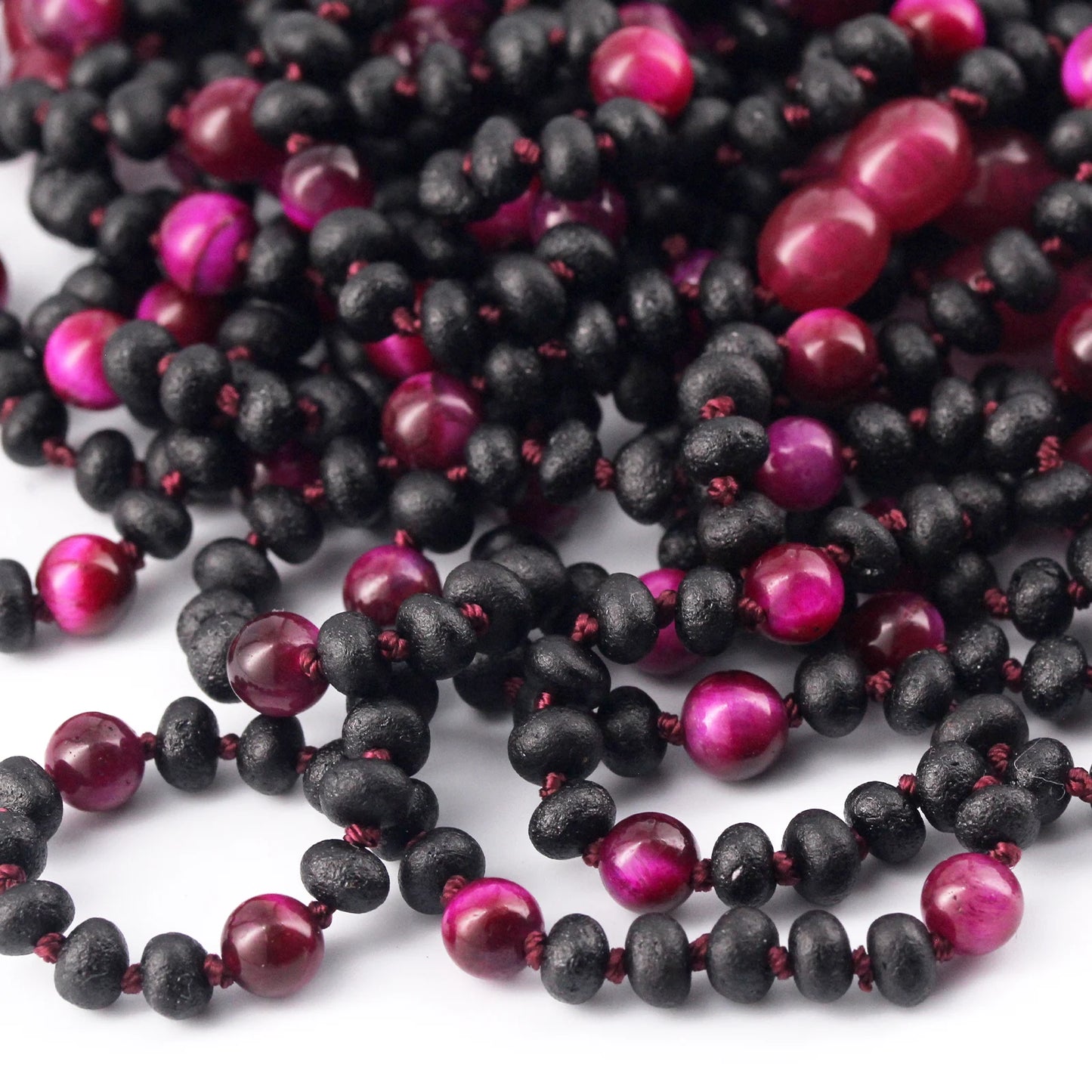 KALUNG BAYI AMBER DENGAN MAGENTA TIGER EYE. LE571