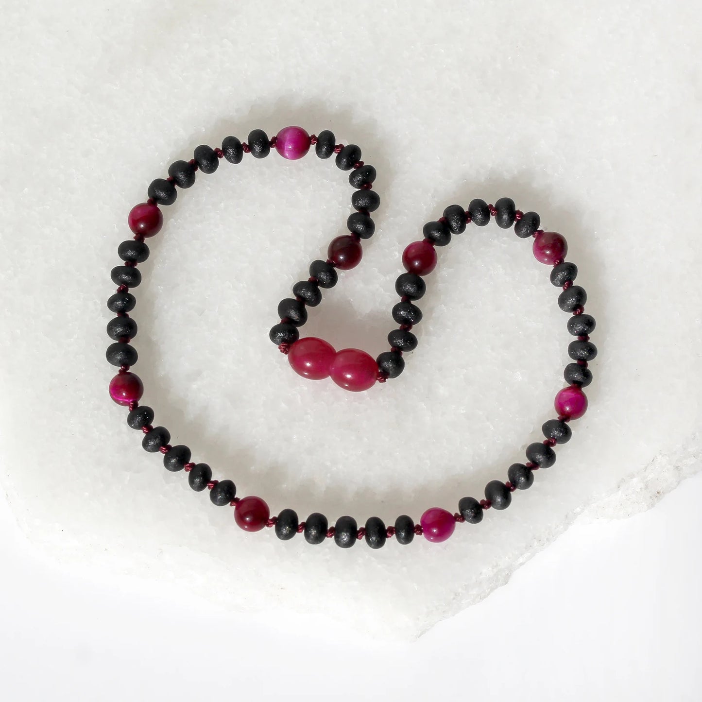 KALUNG BAYI AMBER DENGAN MAGENTA TIGER EYE. LE571