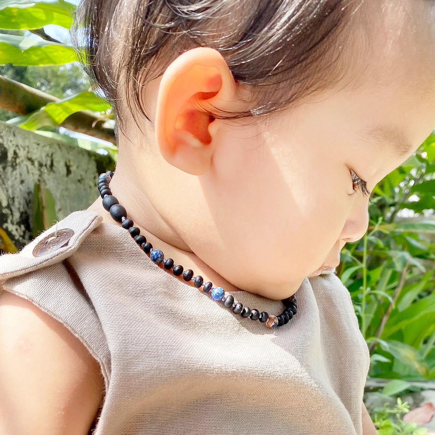 KALUNG BAYI AMBER DENGAN DEEP BLUE IMPERIAL JASPER. LE572