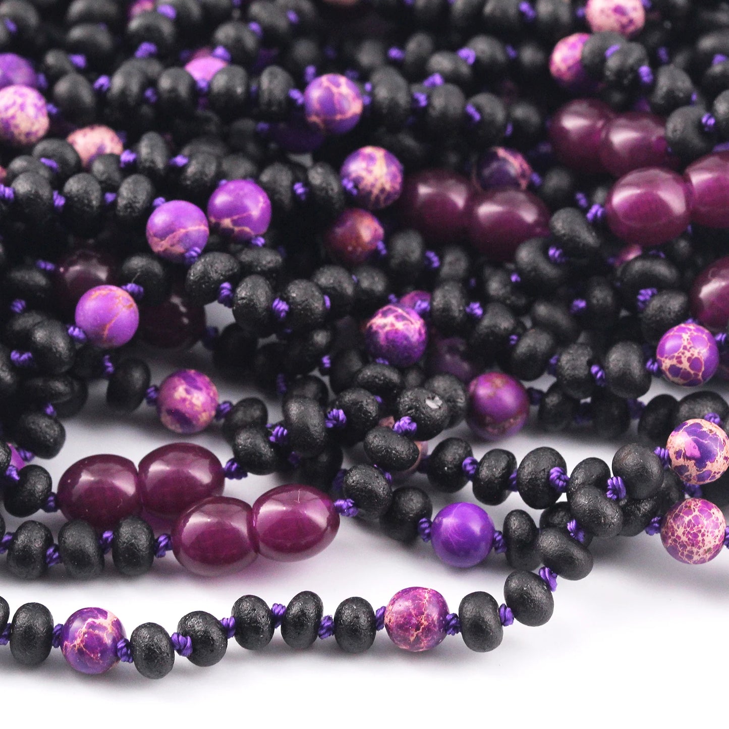KALUNG BAYI AMBER DENGAN PURPLE IMPERIAL JASPER. LE573