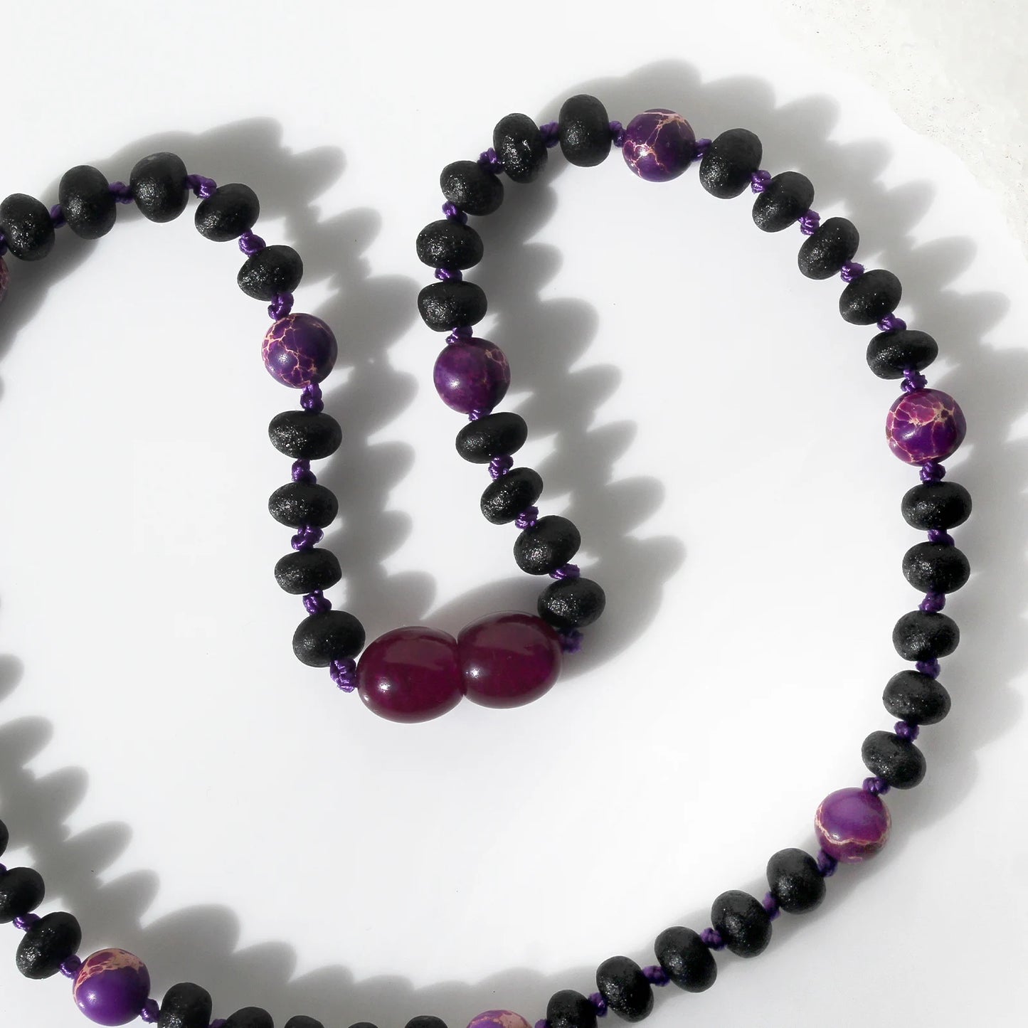KALUNG BAYI AMBER DENGAN PURPLE IMPERIAL JASPER. LE573