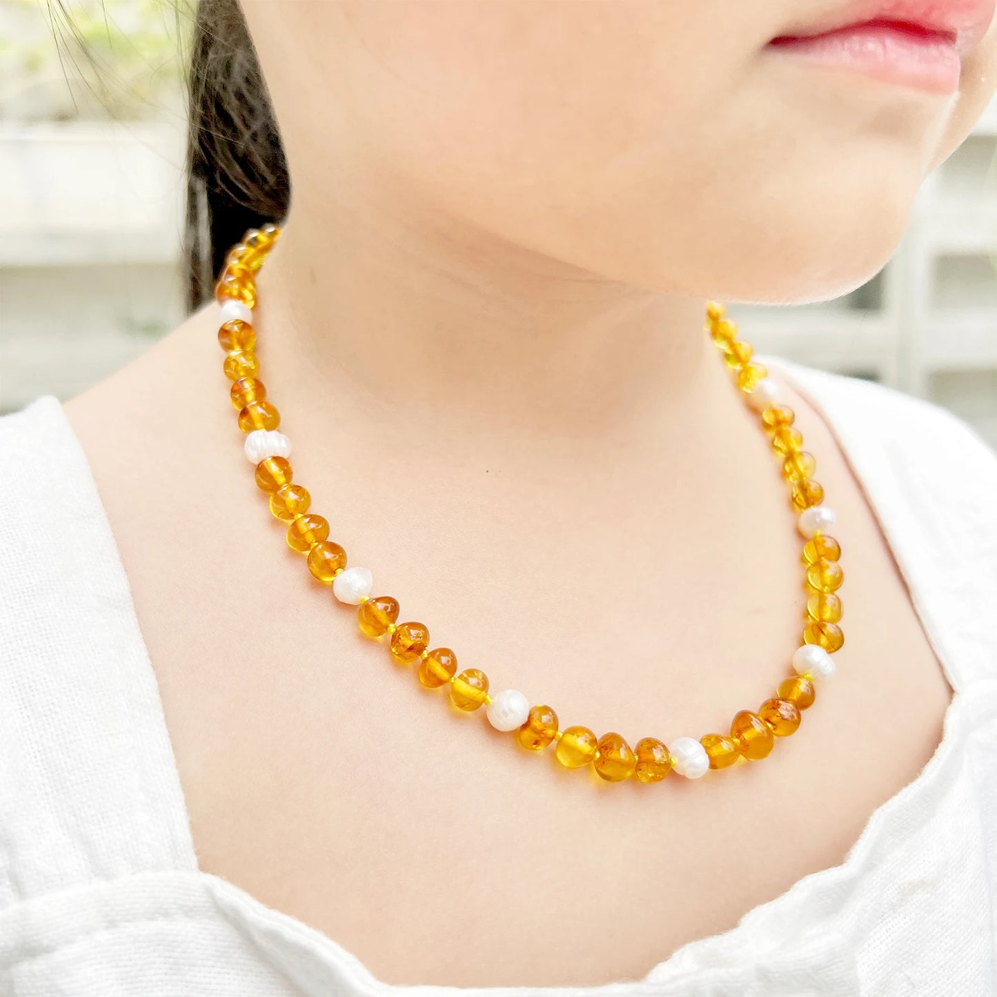 KALUNG AMBER DENGAN WHITE PEARL UNTUK JUNIOR. P1