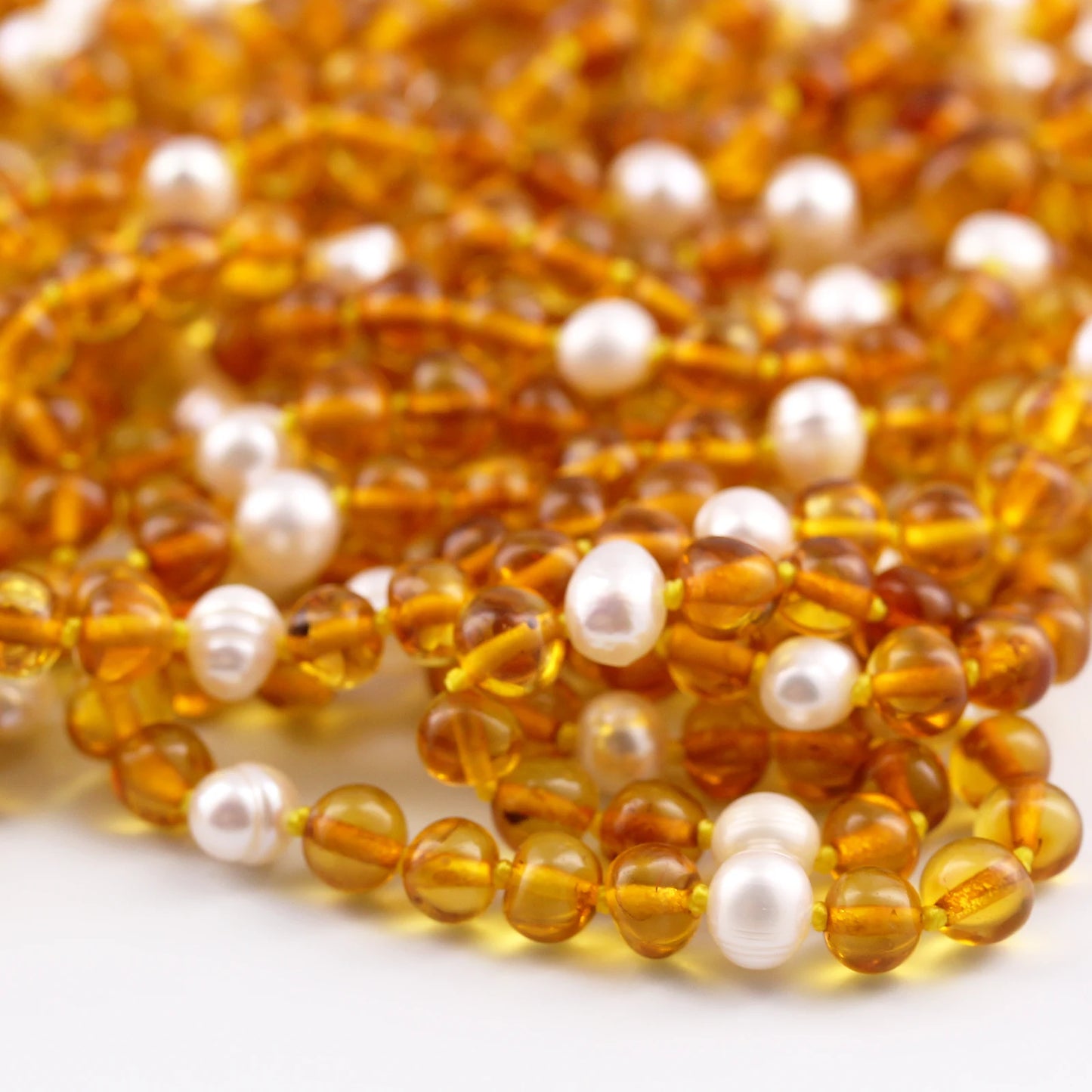KALUNG AMBER DENGAN WHITE PEARL UNTUK JUNIOR. P1