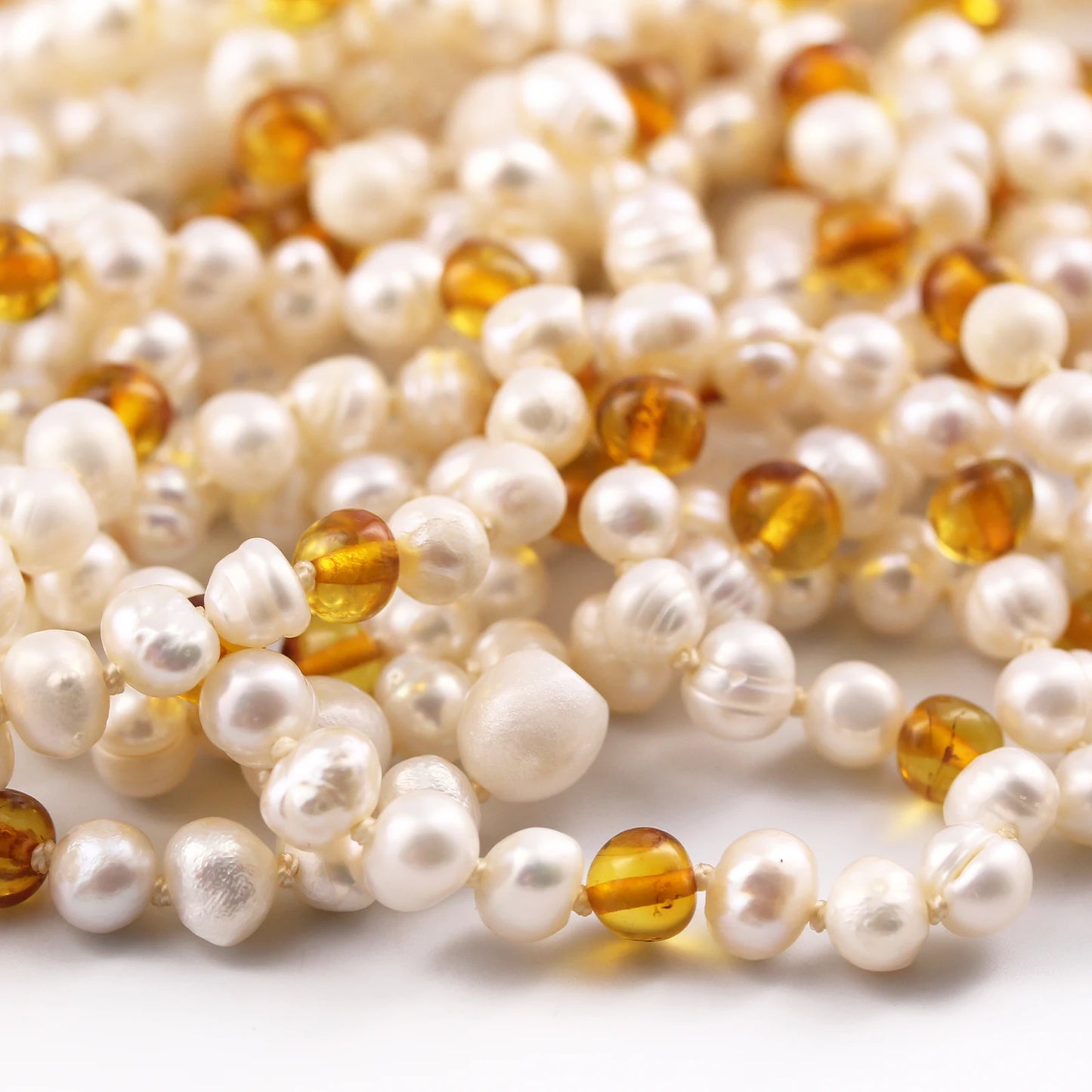 SET BAYI MUTIARA DENGAN BALTIC AMBER. P2