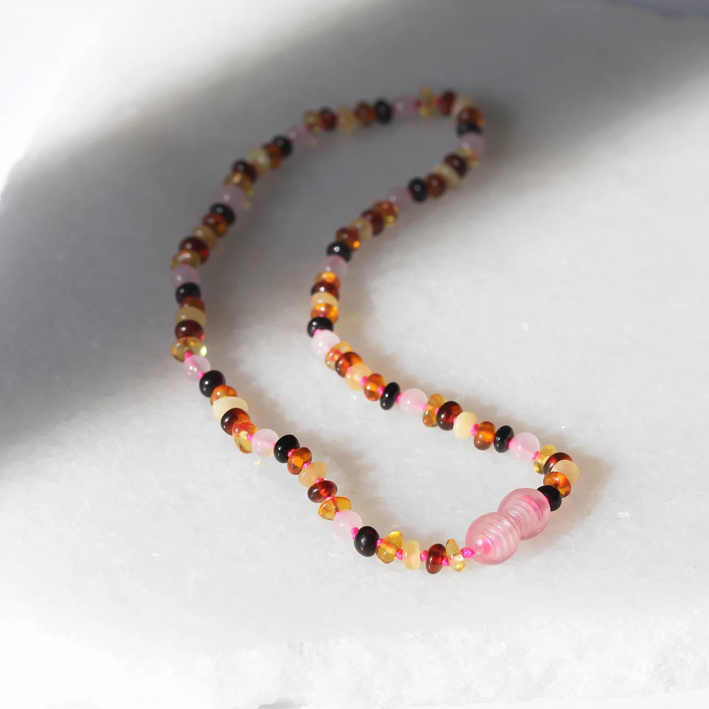KALUNG BAYI AMBER DENGAN ROSE QUARTZ. XR42M-RQ