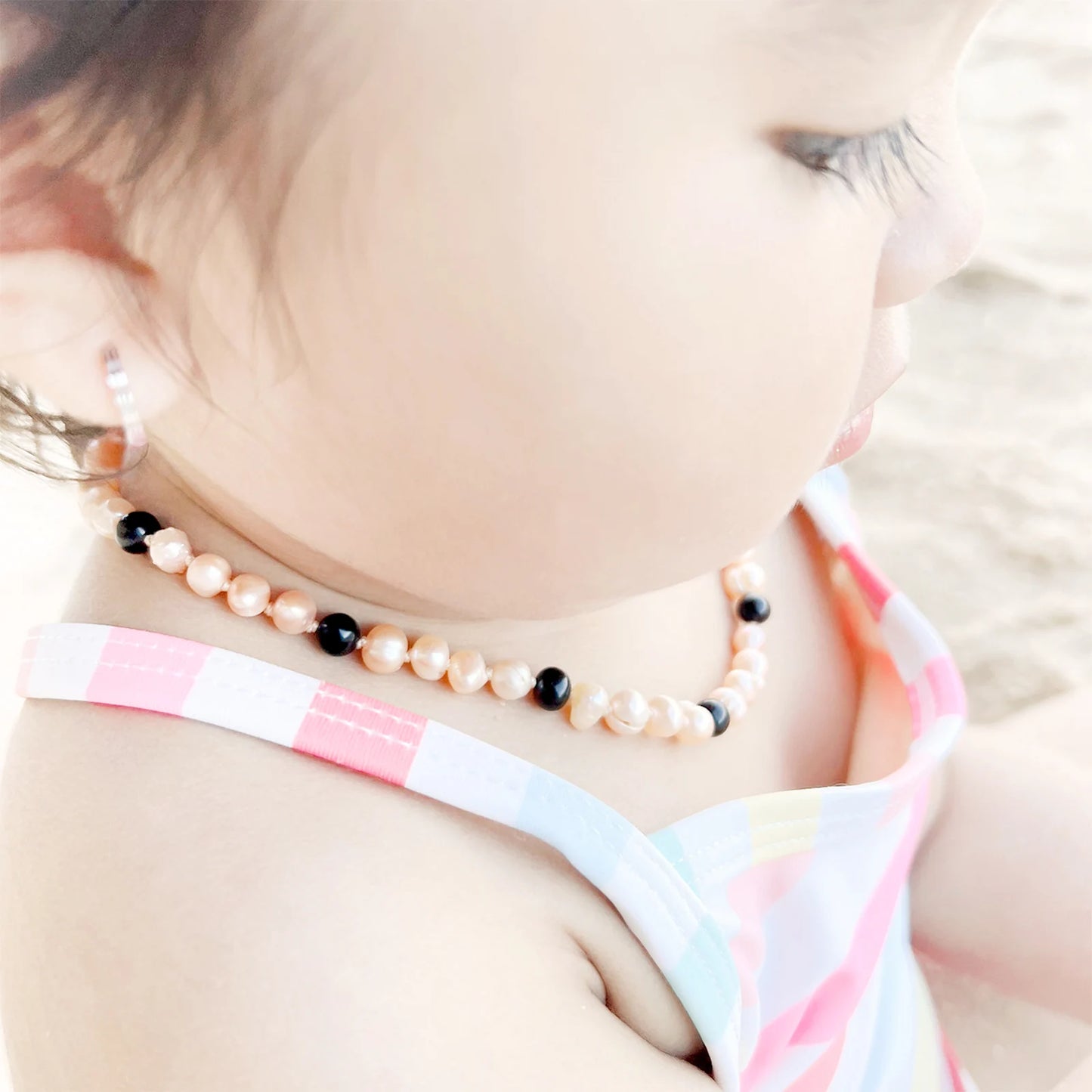 KALUNG BAYI MUTIARA DENGAN BALTIC AMBER. P4